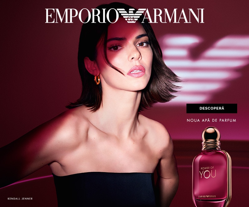 Banner Emporio Armani pentru noul parfum Power of You, cu fundal roșu și sticluță elegantă de parfum prezentată în prim‑plan.